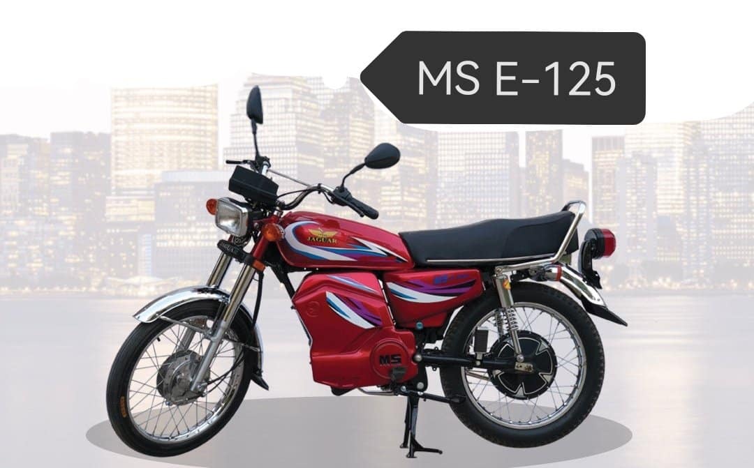 A red motorcycle parked in front of a sign

Description automatically generated with medium confidence