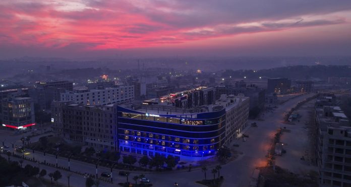 A city with a blue building AI-generated content may be incorrect.
